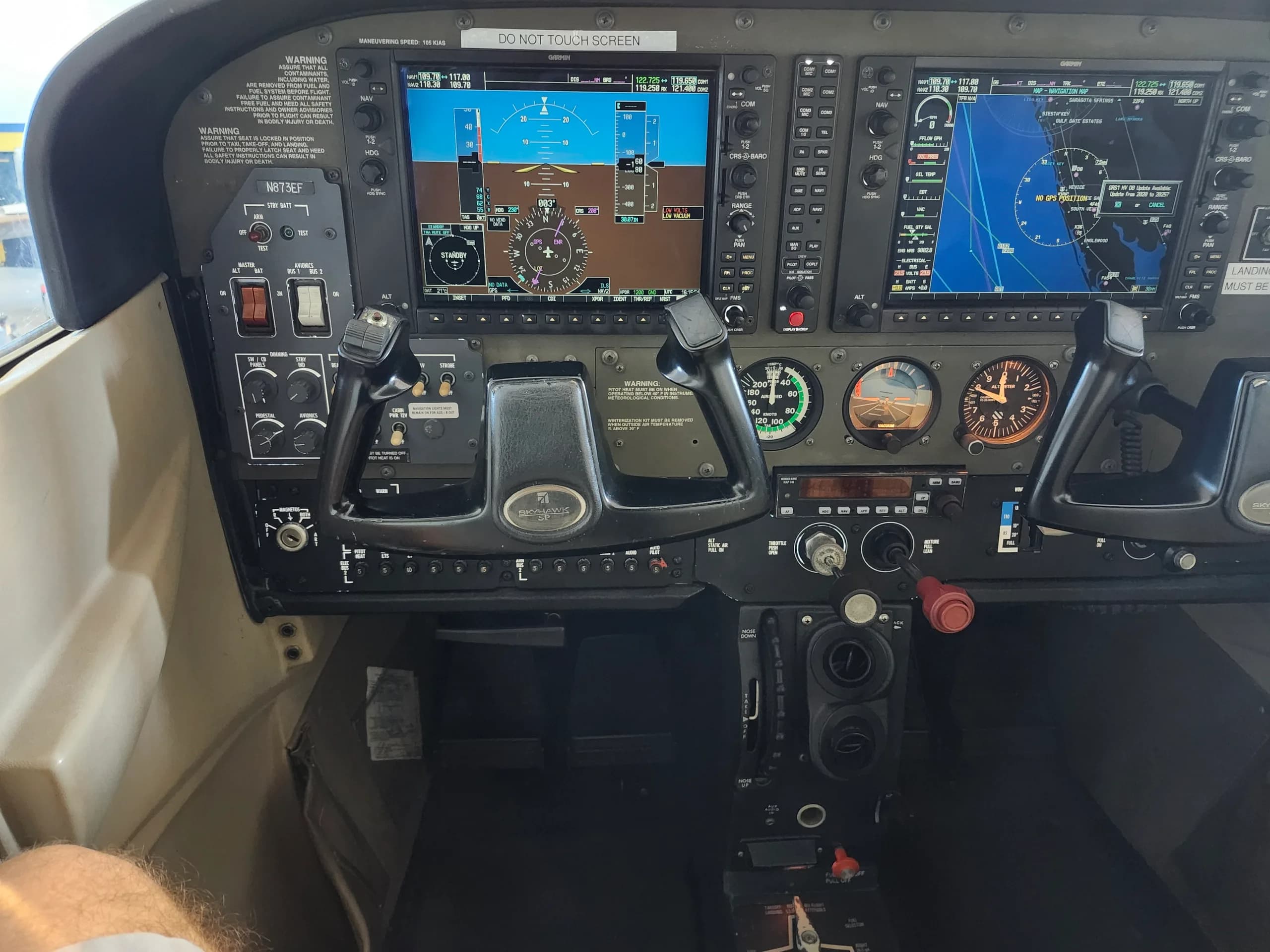 A detailed view of the aircraft's cockpit with modern avionics displays and controls.