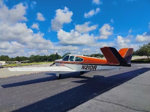Side view of the N210R aircraft on the ground.