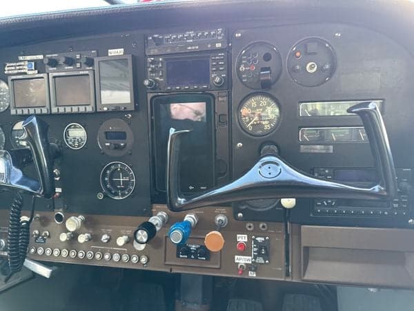 Instrument panel of a Cessna 185 Skywagon with various gauges and controls.
