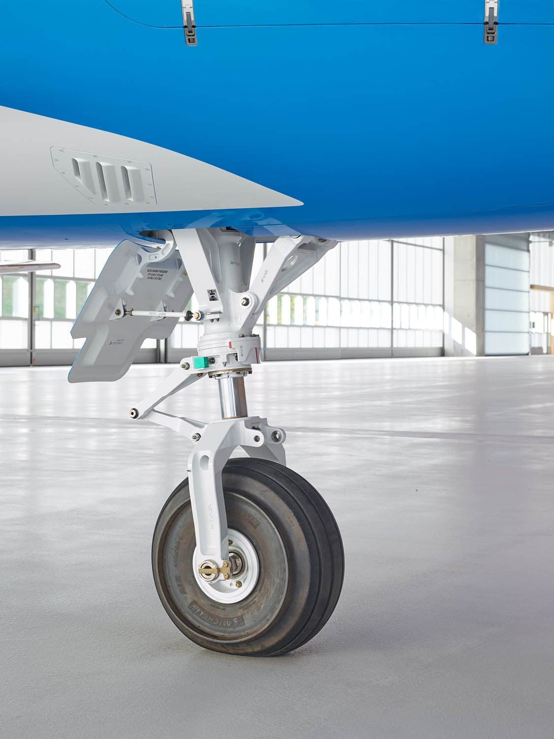 Close up of the landing gear of a Pilatus PC-24.