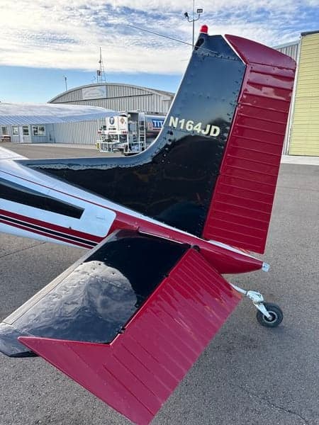 Tail section of a Cessna 185 Skywagon with the registration number N164JD.