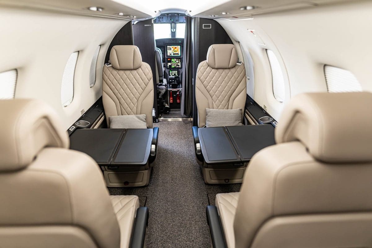 View of the aircraft interior, showing the seats and cockpit.