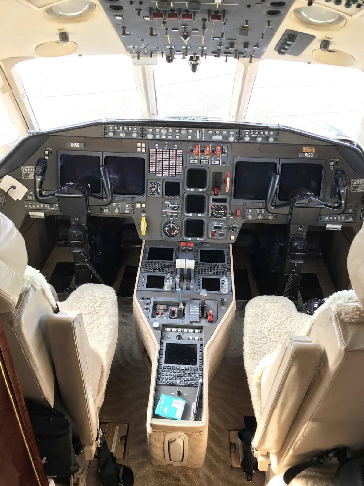 The aircraft's cockpit features a full instrument panel and seating for two pilots.
