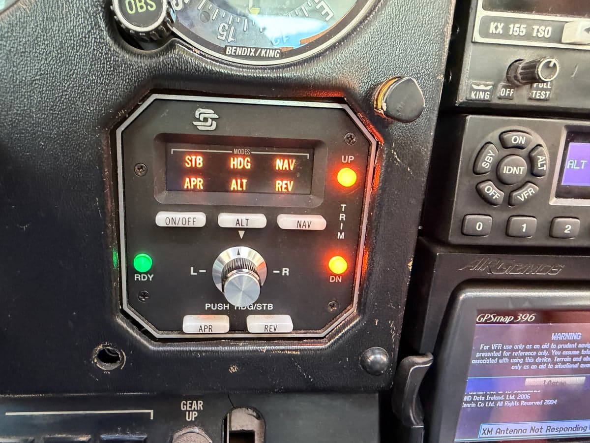 Close-up of the STEC autopilot system in the aircraft's cockpit.