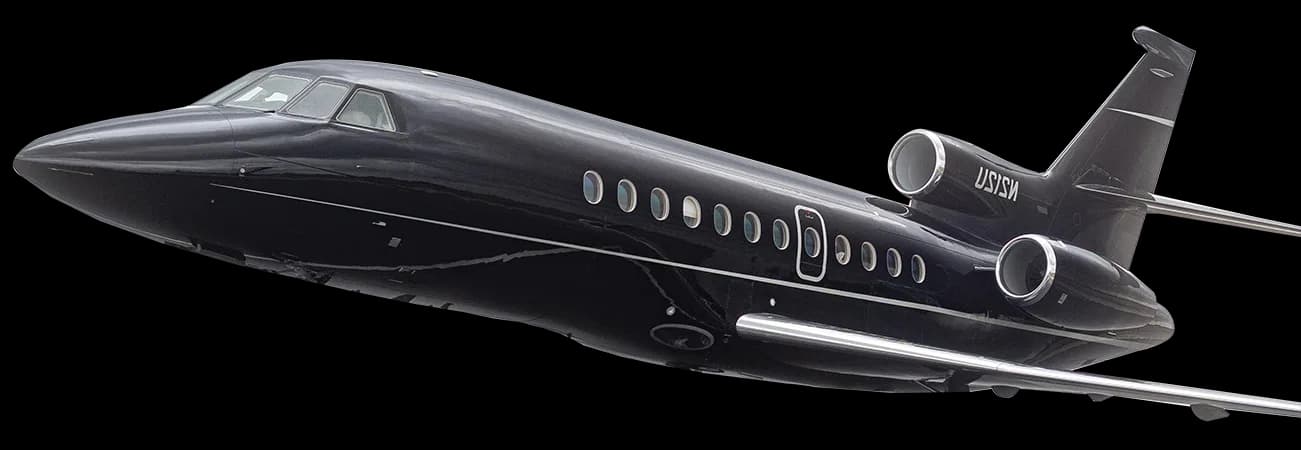 A black Falcon jet is shown in flight against a black background.