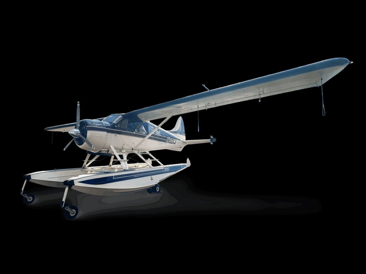 A white and blue floatplane is shown against a black background.