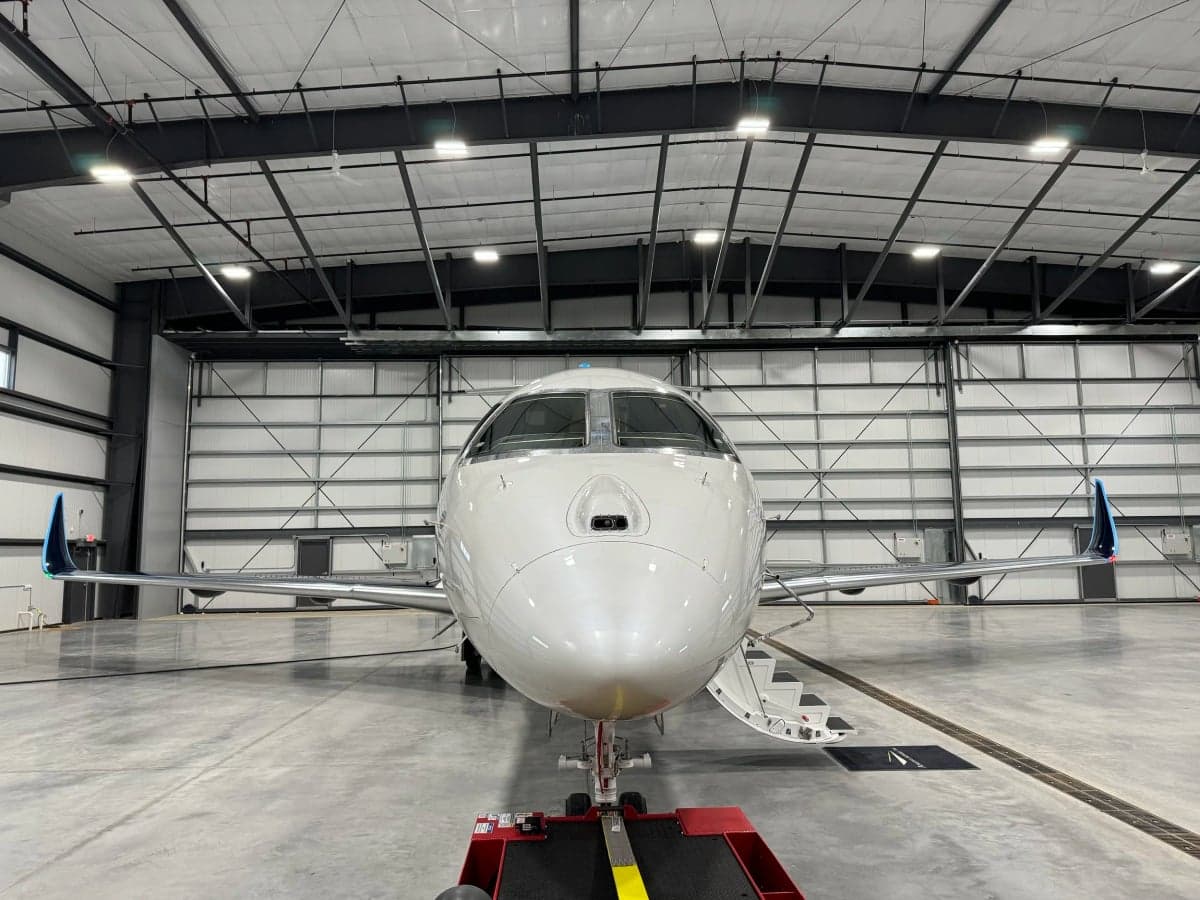 N602EE Praetor 600 aircraft in a hangar, front view.