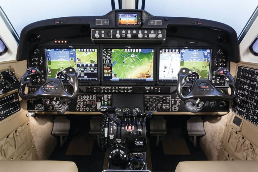 The cockpit of a King Air aircraft with advanced avionics.