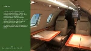 Interior of the Cessna CitationJet with seats and tables, and text about the aircraft.