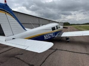 Rear side view of the N5579J aircraft on the tarmac.