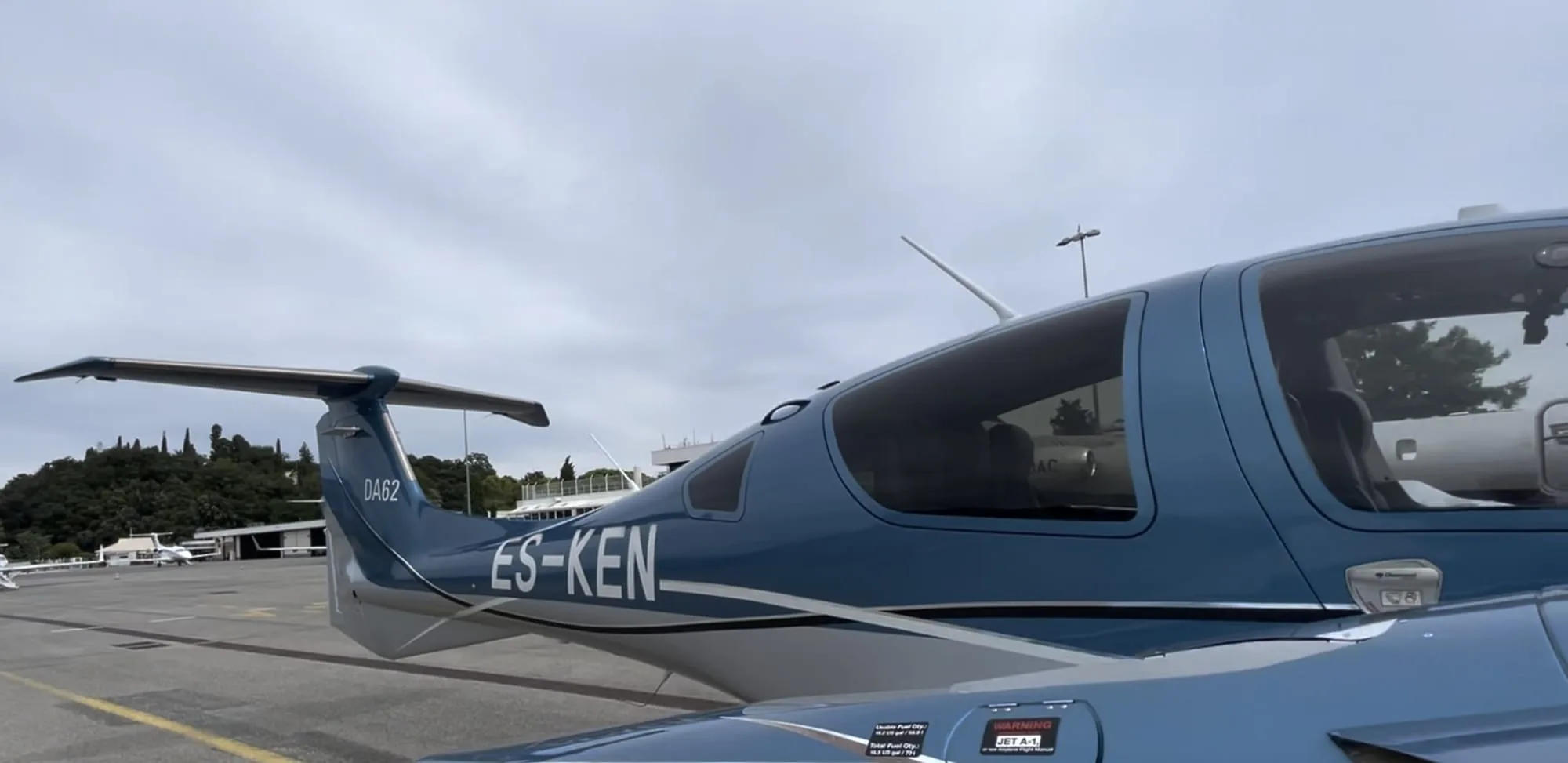 Close-up of the tail and fuselage of a Diamond DA62 aircraft.