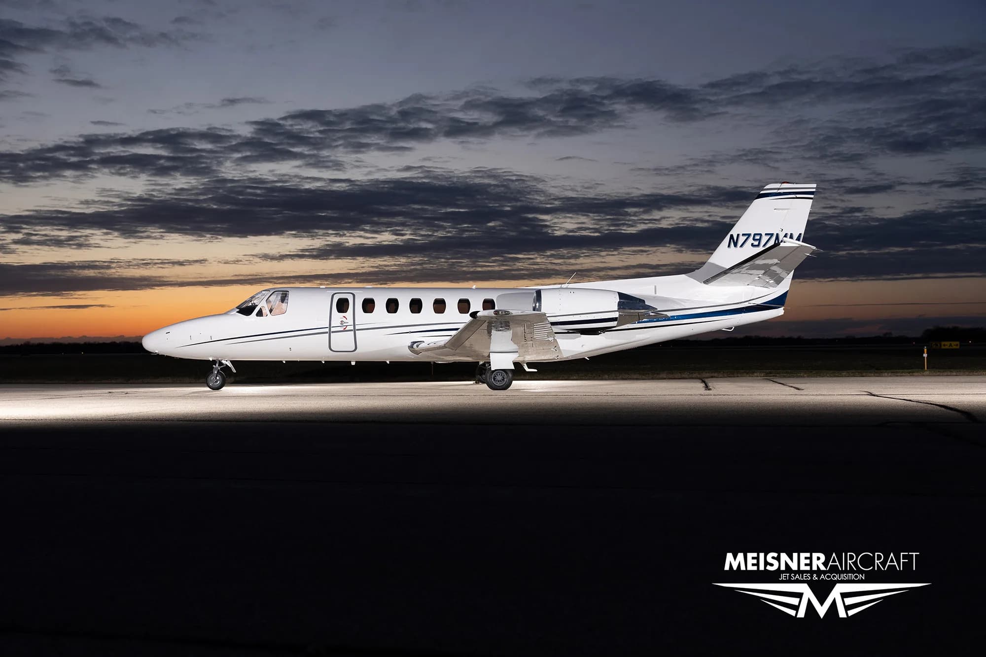 N797MM Cessna Citation on the tarmac at dusk, side view.