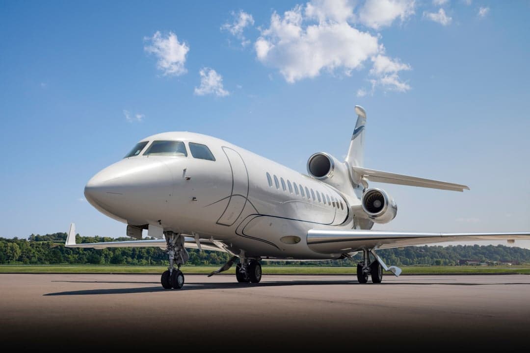 Low angle view of the white aircraft on the tarmac.