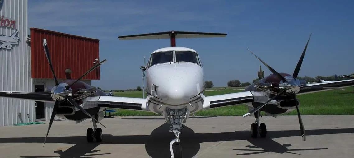 Front view of a Beechcraft King Air 300 on the tarmac.