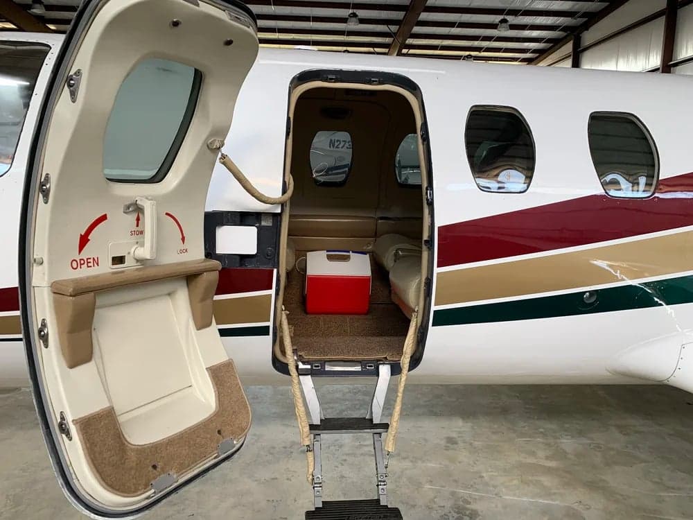 View of the aircraft door and steps leading into the cabin.