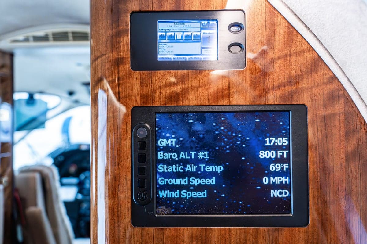 Close-up of a display showing flight information in the aircraft cabin.