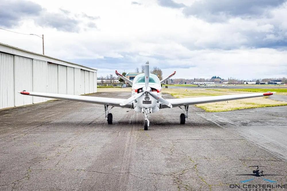 Front view of the Beechcraft Bonanza N454RB on the tarmac.