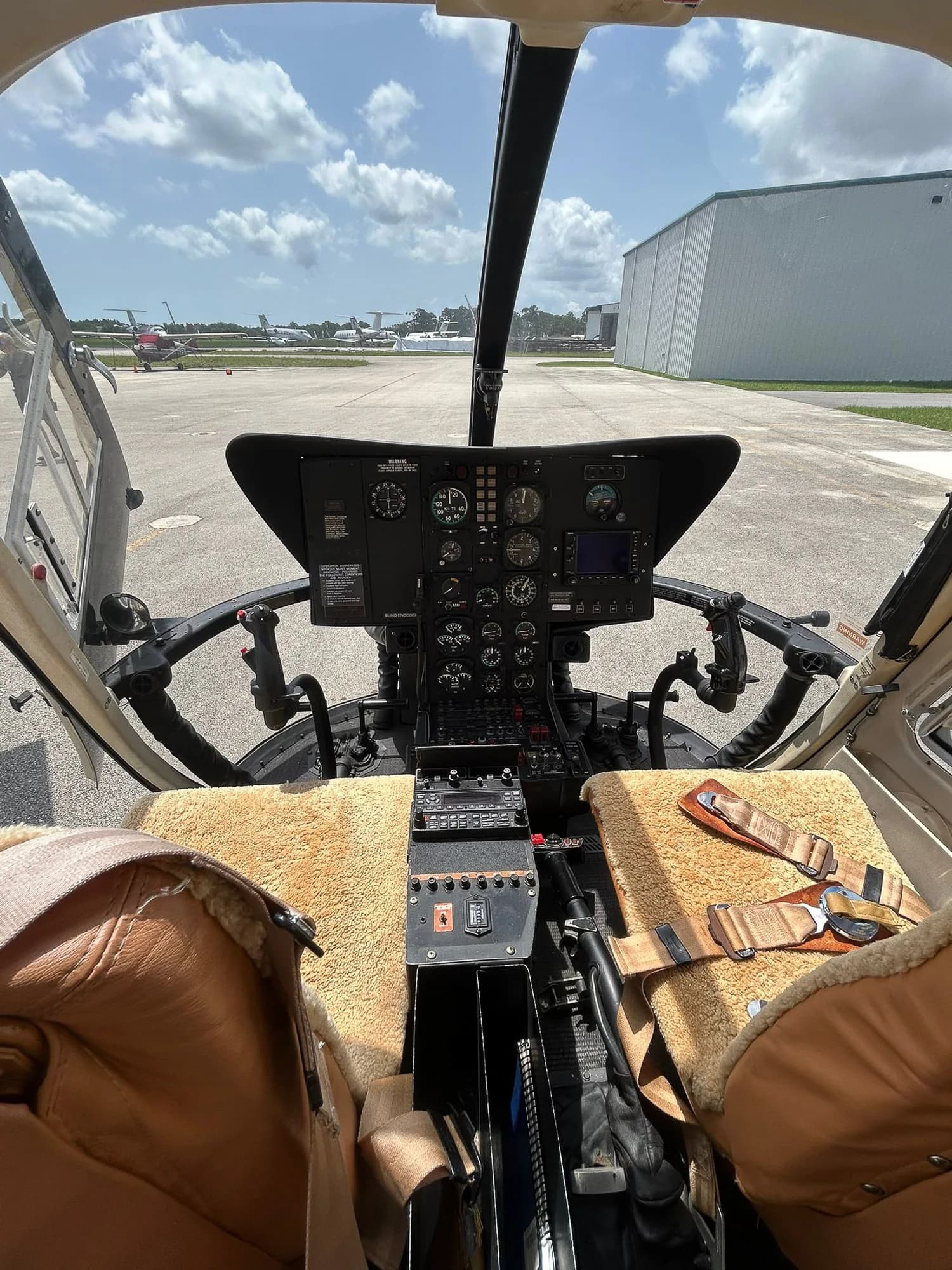 View of the helicopter's cockpit instrument panel from the pilot's seat.