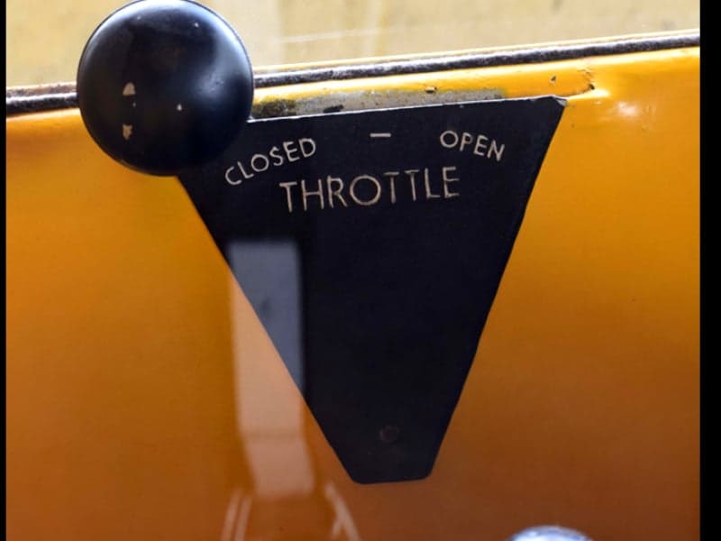 Close-up of the throttle control in the cockpit of the aircraft.