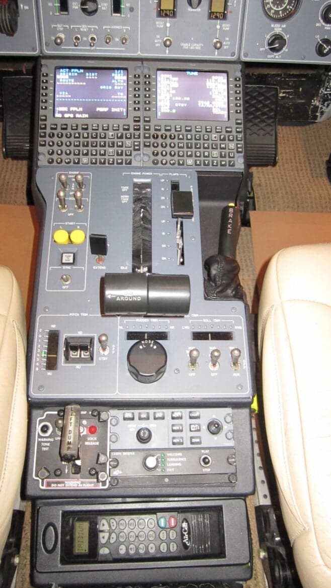The center console and lower instrument panel in the cockpit.