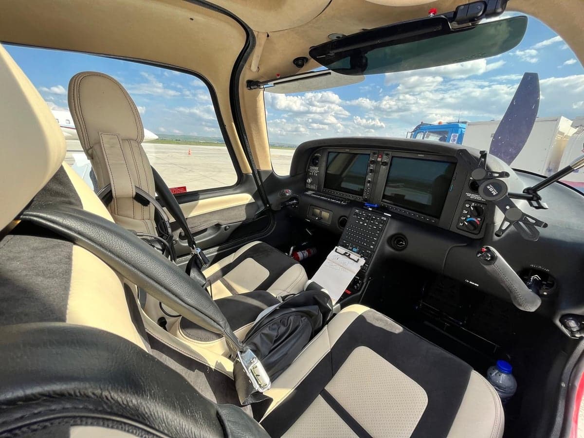 View of the cockpit instrument panel and seats.