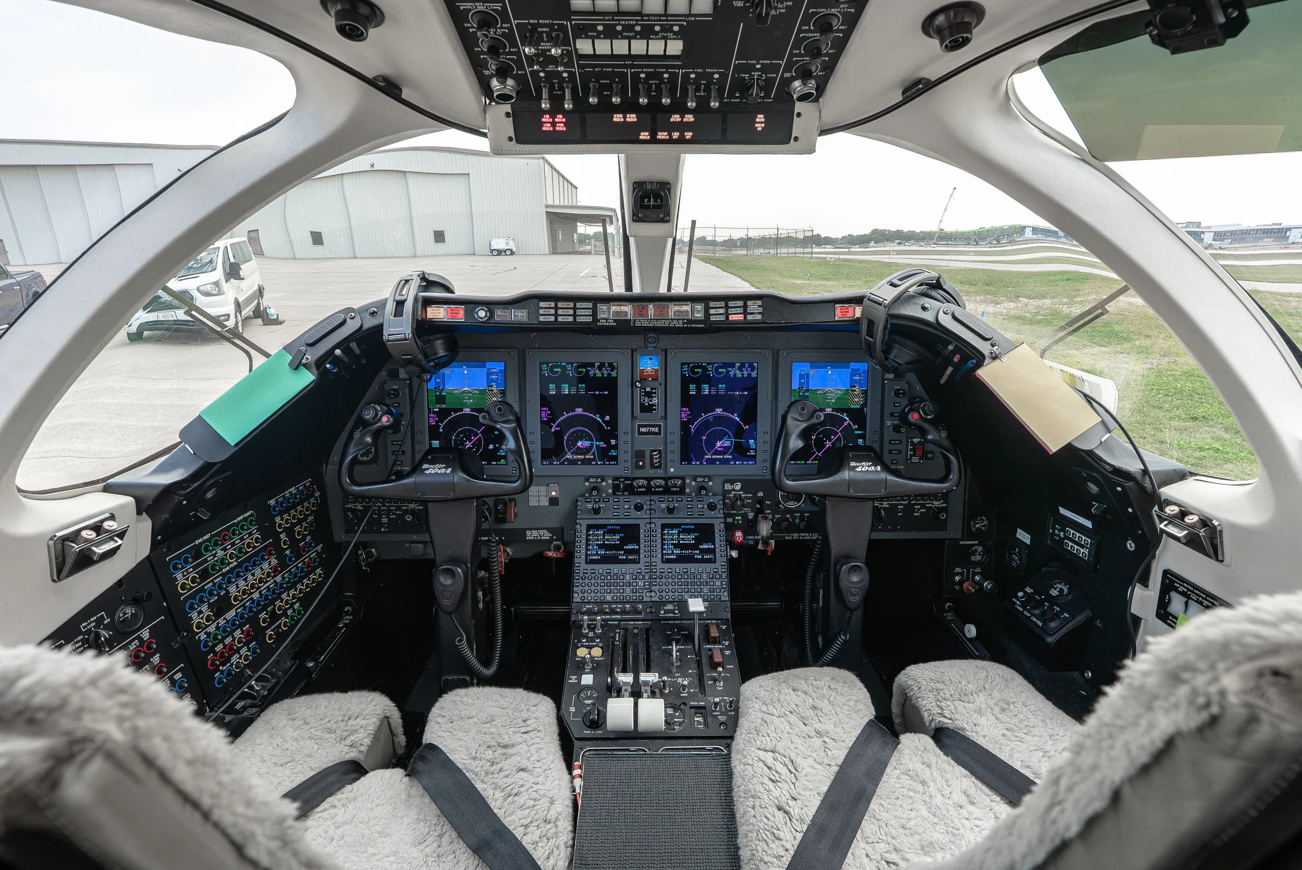 View of the aircraft cockpit with instrument panel and seats.
