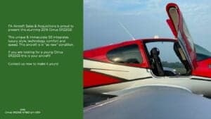 Close-up of the open door of a Cirrus SR22G6 aircraft with red and white paint scheme.