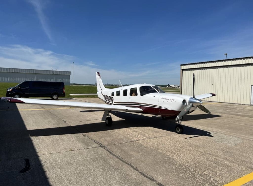 A Piper Saratoga II TC parked on the tarmac.