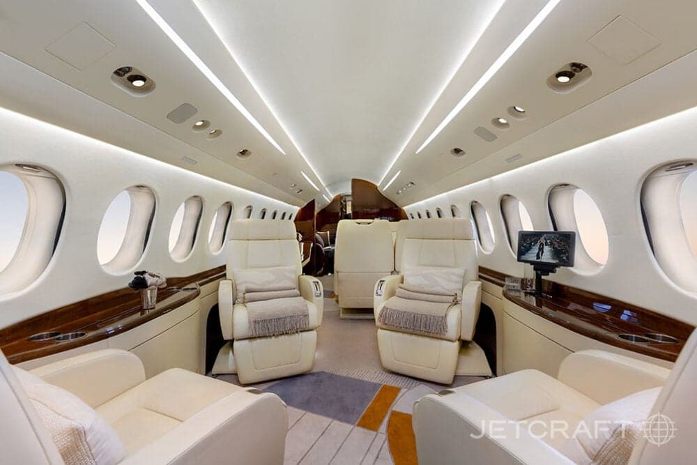 The aircraft's interior features luxurious seating and amenities.