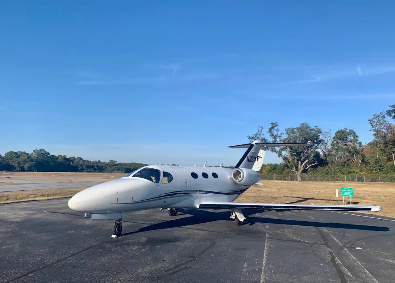 A Cessna Citation CJ3 parked on the tarmac.