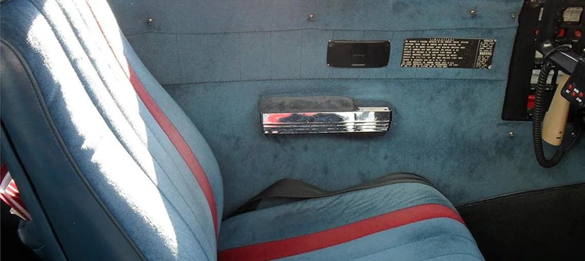 Close-up of the aircraft's blue seat with a red stripe.