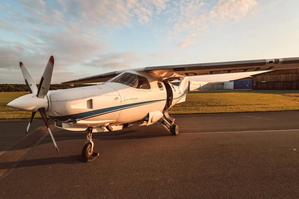 Front view of the Extra 400 aircraft D-ETTH with the door open.