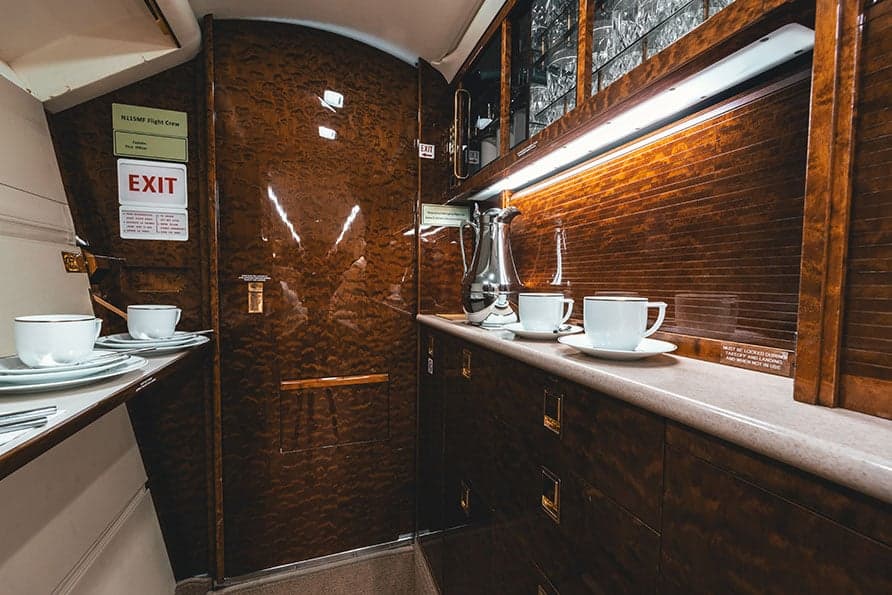 A refreshment area in the Falcon 7X cabin includes a coffee service and storage.