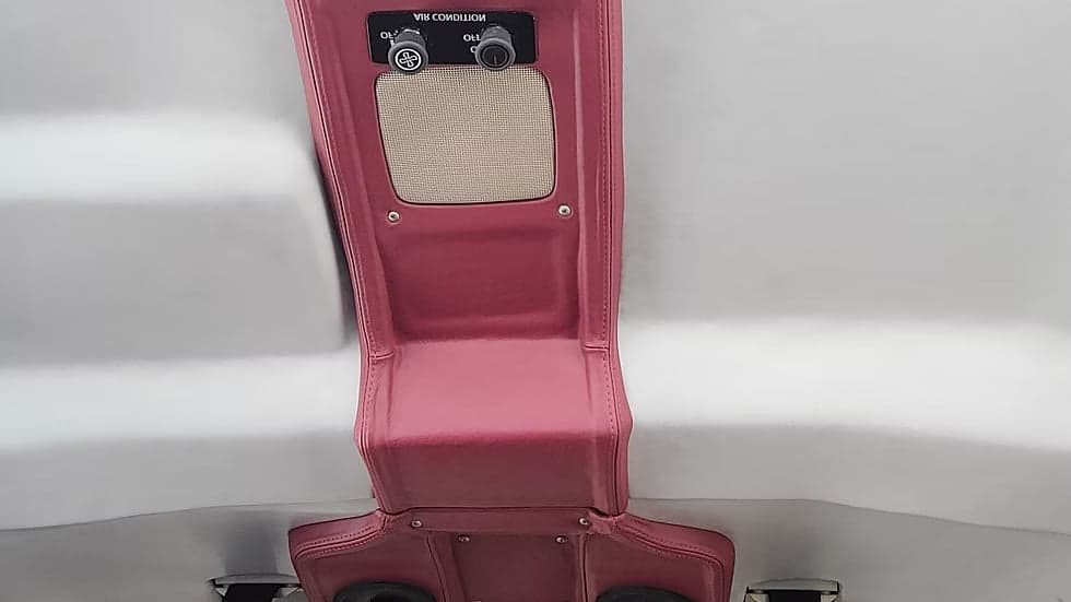 View of the aircraft's interior ceiling and air conditioning controls.