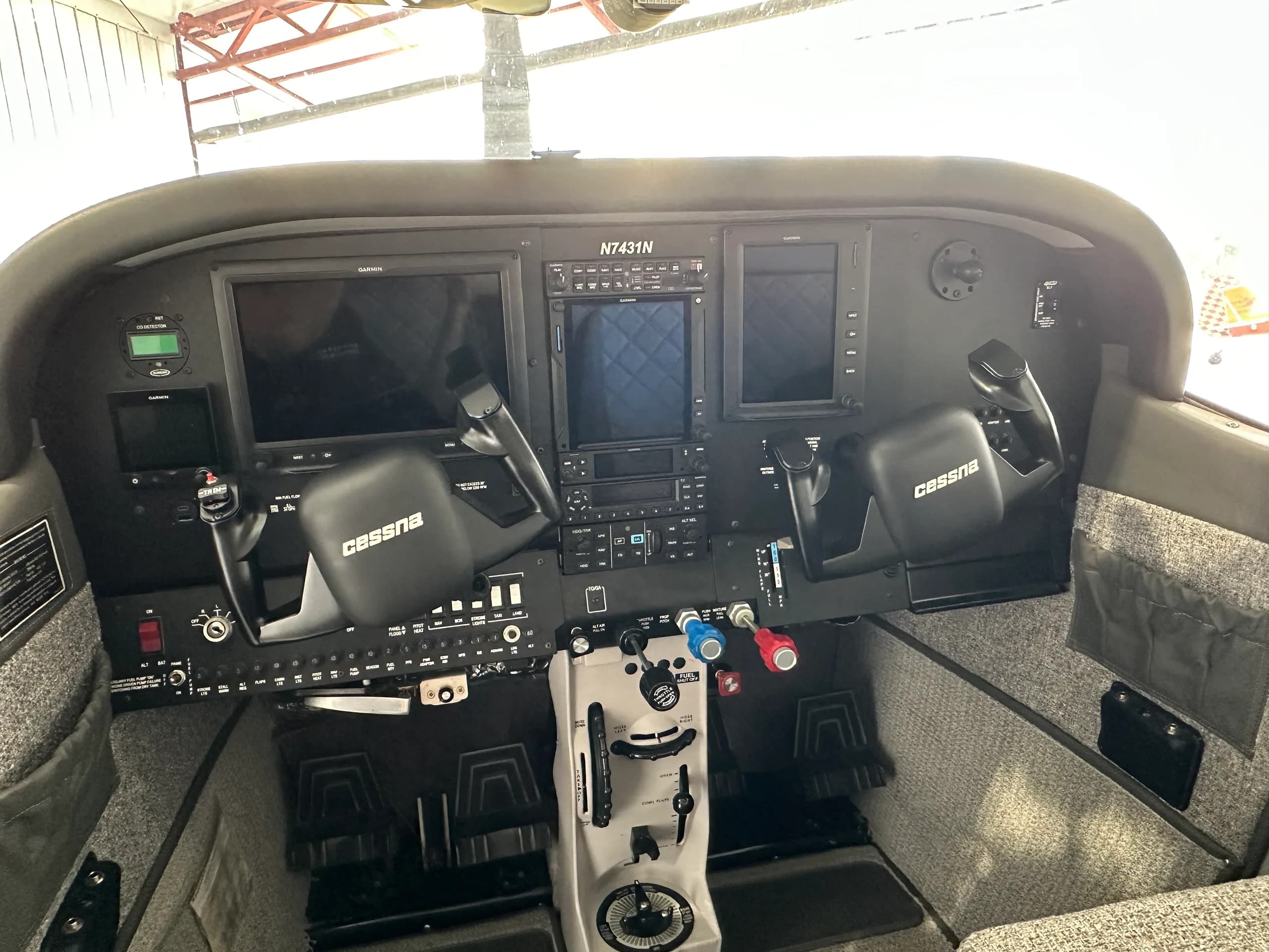 Detailed view of the Cessna 182 Skylane cockpit instrument panel.