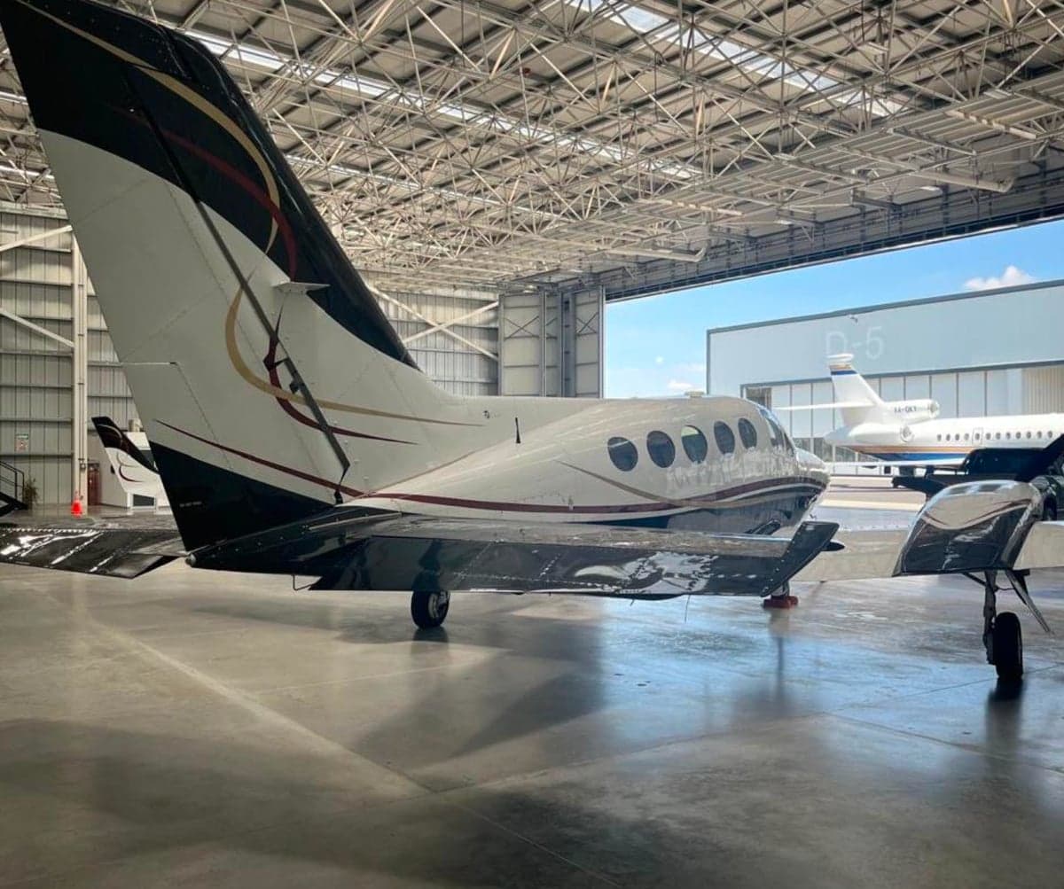 Side view of a Cessna 421 Golden Eagle aircraft parked in a hangar.