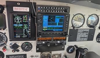 The cockpit of the aircraft shows the instrument panel.