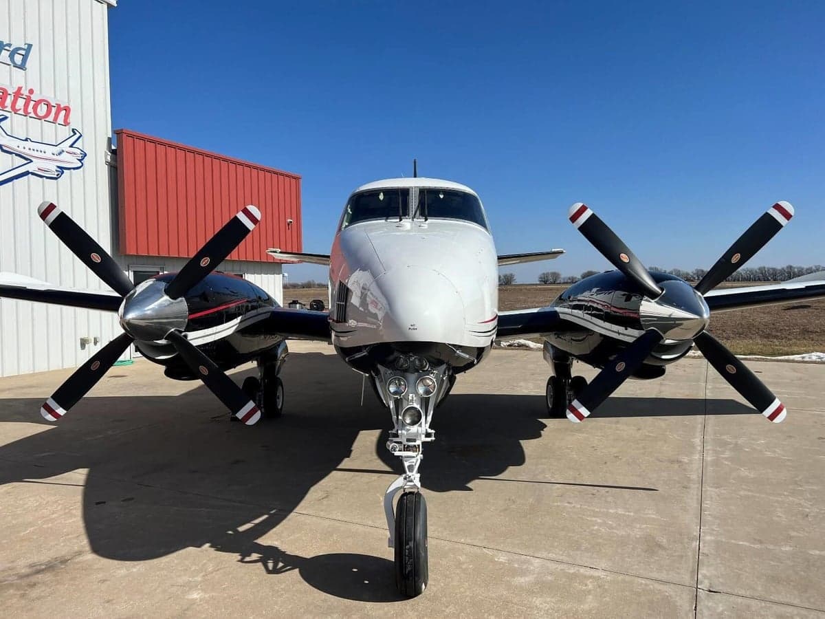 Front view of a Beechcraft King Air with black and white paint scheme.