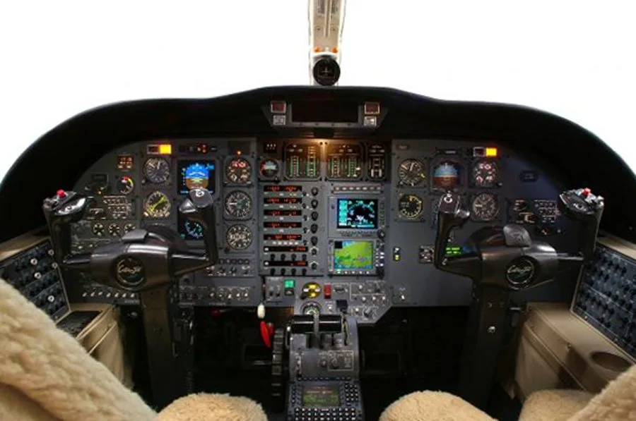 The cockpit features a full instrument panel and dual control sticks.