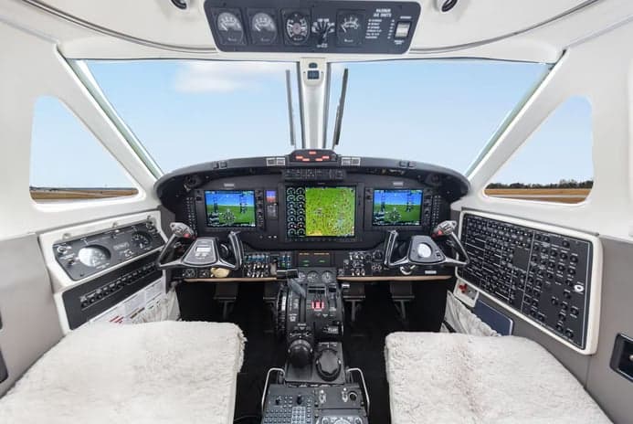 The cockpit of a Beechcraft King Air 200 with modern avionics.