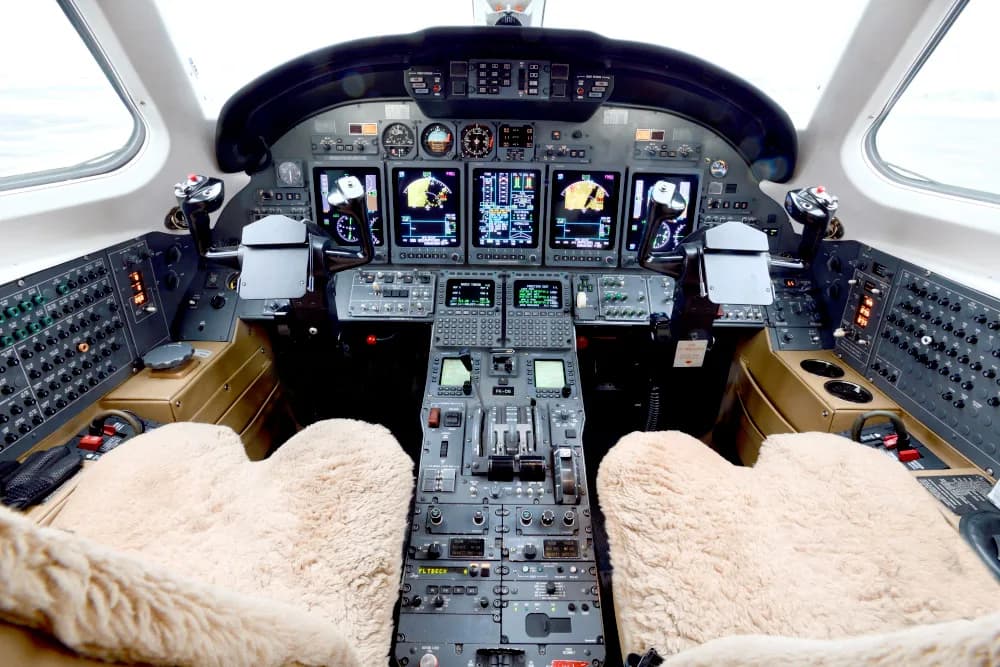 The cockpit of a Citation CJ3 aircraft with modern avionics.