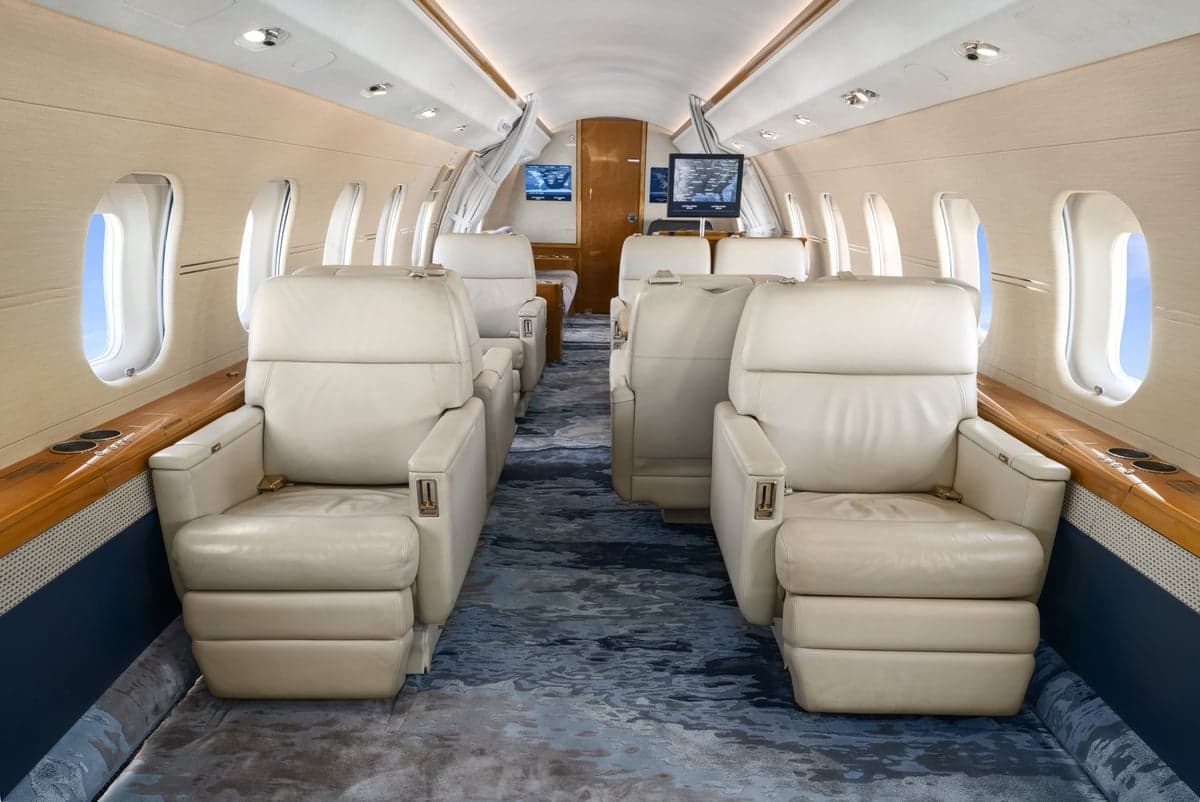 The interior of a Bombardier Global Express with cream leather seats.