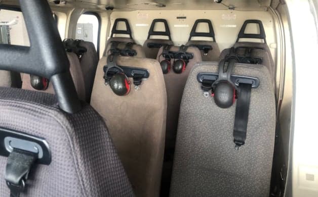 Helicopter cockpit with instrument panel and controls.
