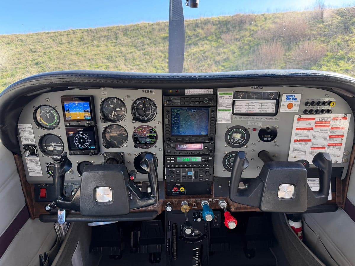 The cockpit of the N8268M aircraft, featuring the instrument panel and controls.
