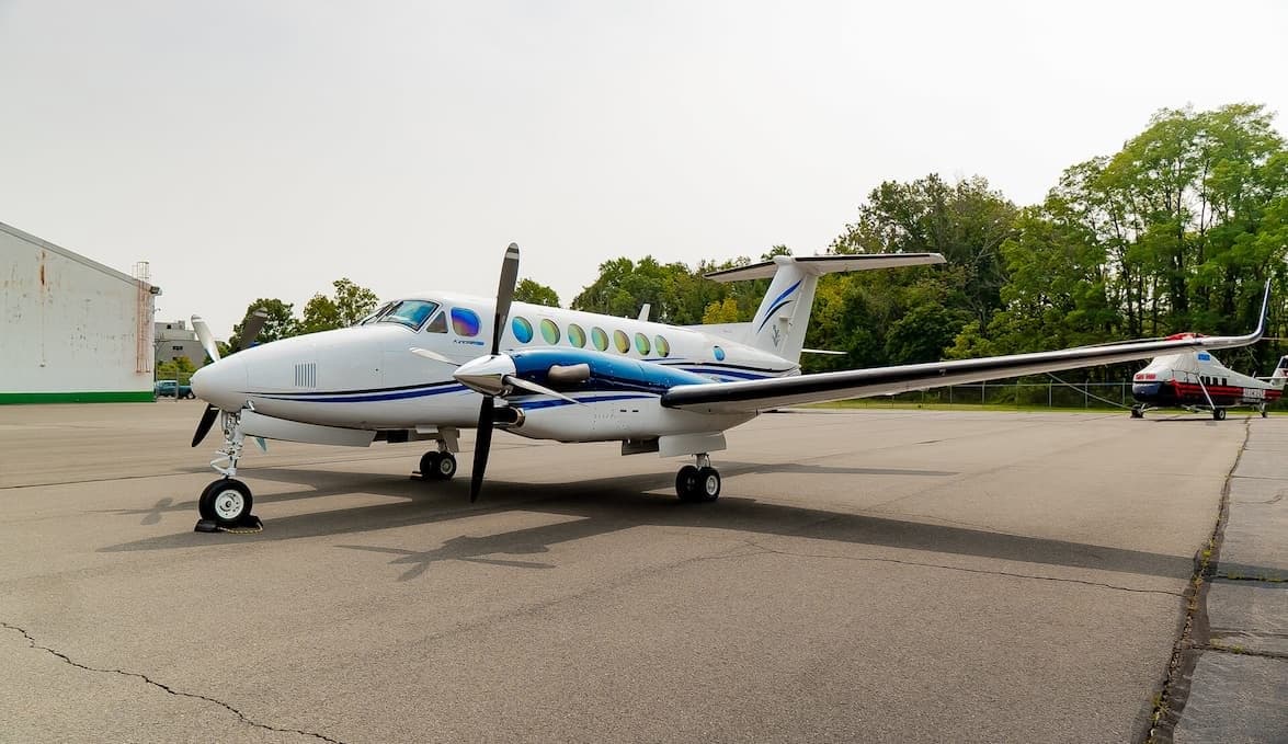 Side view of a Beechcraft King Air on the tarmac.