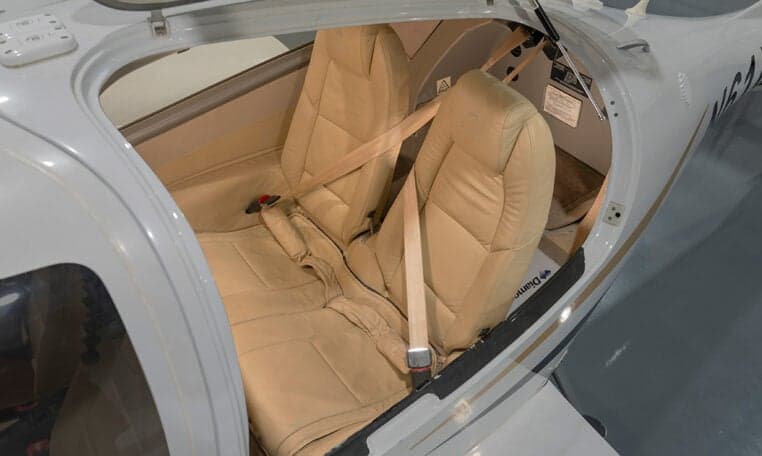 Interior view of the Diamond DA62 aircraft showing the seats and seatbelts.