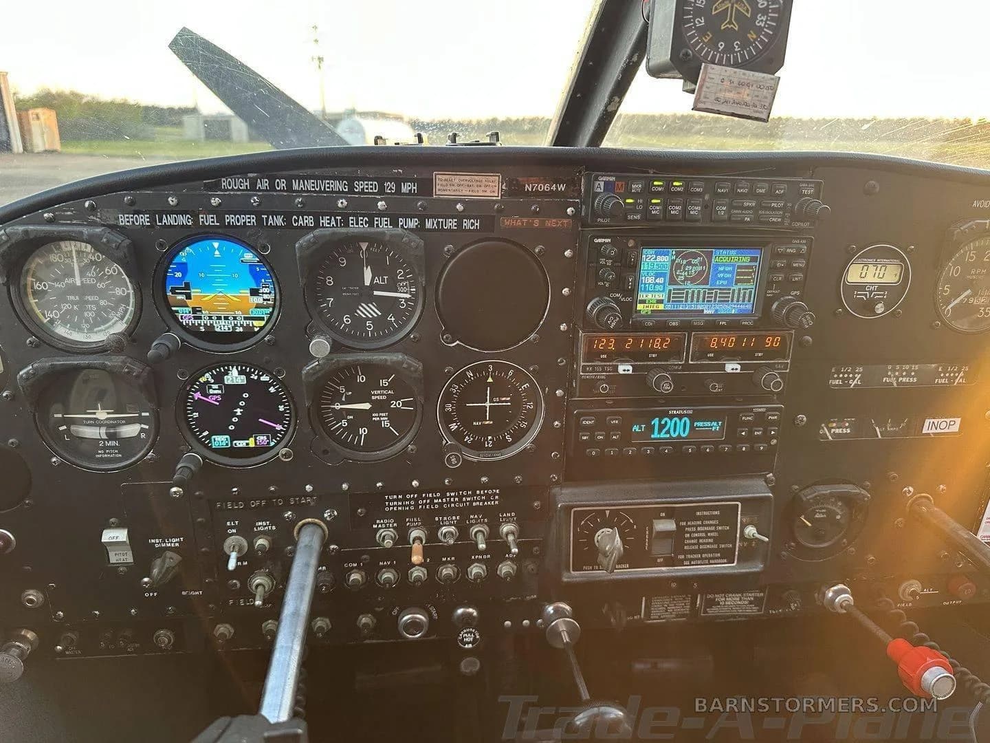 A close-up view of the aircraft's instrument panel, highlighting the gauges and avionics.