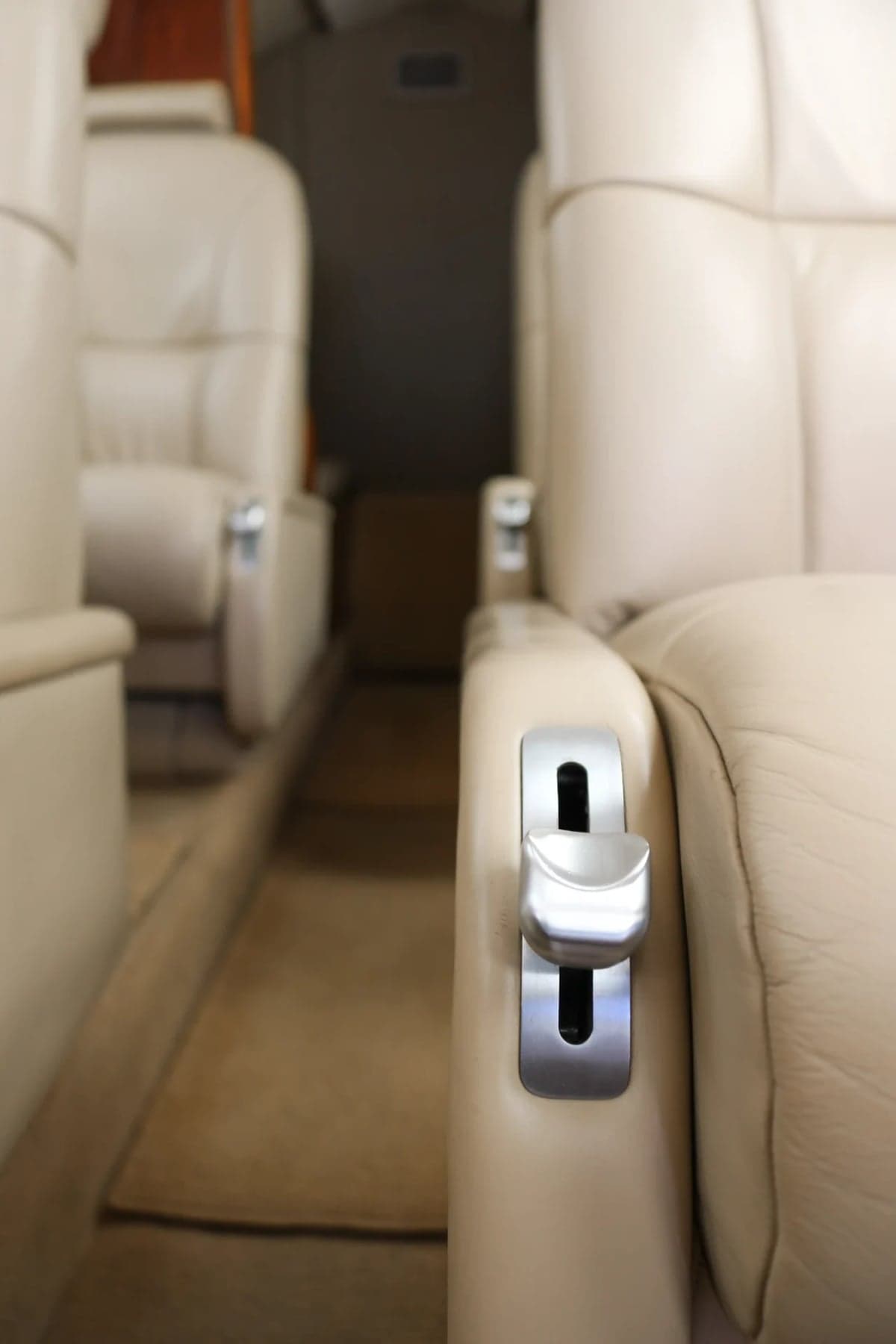 Close-up of a Citation CJ2 cabin seat and controls.