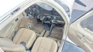 Interior view of the aircraft cabin and cockpit.