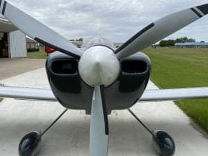 Close-up front view of the N194PT aircraft propeller and cowling.